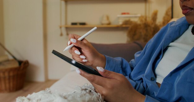 Person using both digital tablet and paper planner
